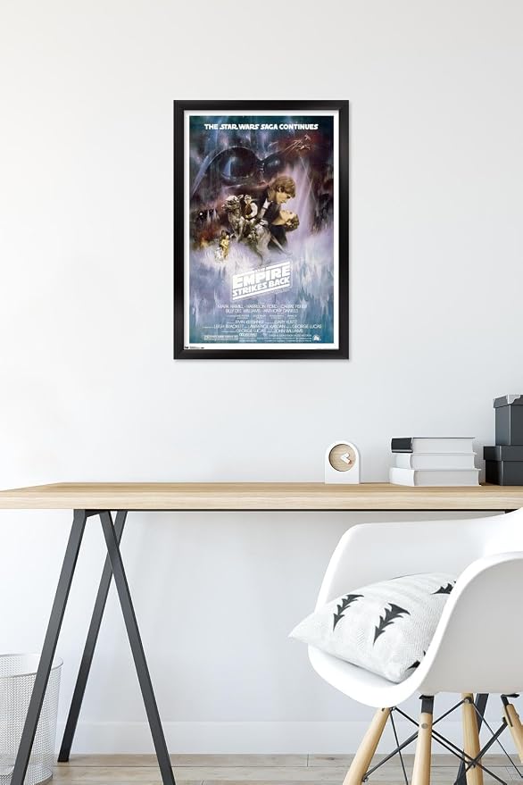 Trends International Star Wars: The Empire Strikes Back - The Saga Continues One Sheet Wall Poster, 14.725" x 22.375", Black Framed Version