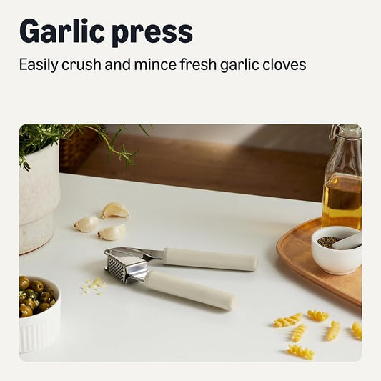 Amazon Basics Garlic Press, Stainless Steel, Soft Grip Handle, Dishwasher-Safe, Linen Gray