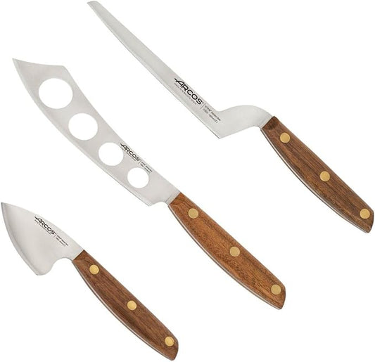 Arcos Cheese Knife set 3 pieces. Nitrum Stainless Steel. Very useful set for irregular pieces of hard cheeses, soft cheeses and creamy cheeses. Handle 100% Ovengkol wood Series Nordika. Color Brown.