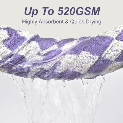 Purple and white patterned towel being squeezed to show water drainage, with text reading 'Up To 520GSM' and 'Highly Absorbent & Quick Drying' on a light gray background.