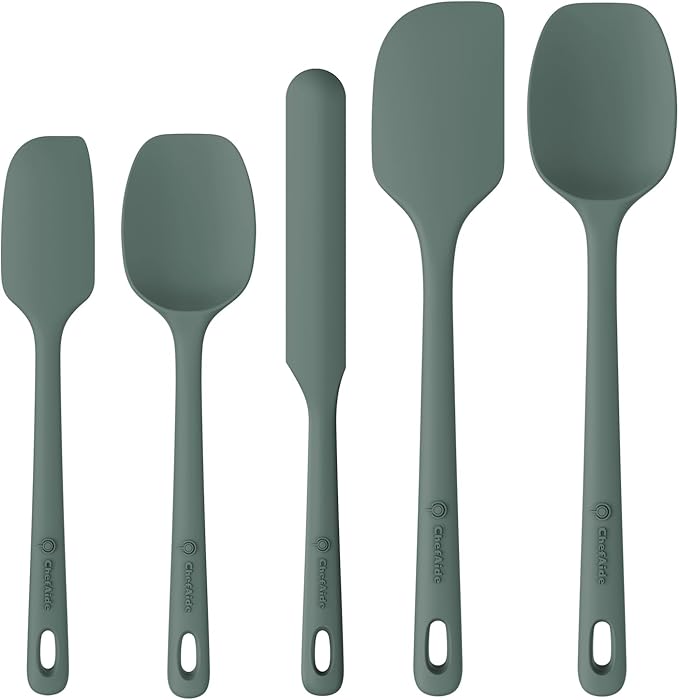 Set of five black silicone spatulas on a white background