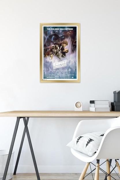 Trends International Star Wars: The Empire Strikes Back - The Saga Continues One Sheet Wall Poster, 14.725" x 22.375", Gold Framed Version
