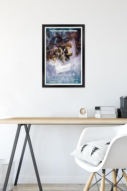 Trends International Star Wars: The Empire Strikes Back - The Saga Continues One Sheet Wall Poster, 14.725" x 22.375", Black Framed Version