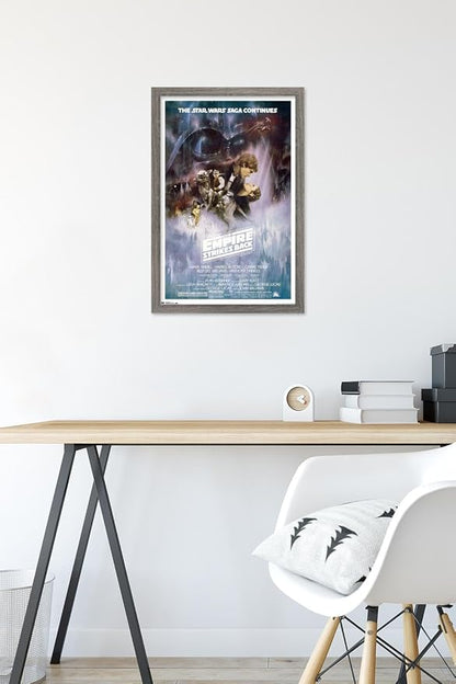 Trends International Star Wars: The Empire Strikes Back - The Saga Continues One Sheet Wall Poster, 14.725" x 22.375", Barnwood Framed Version