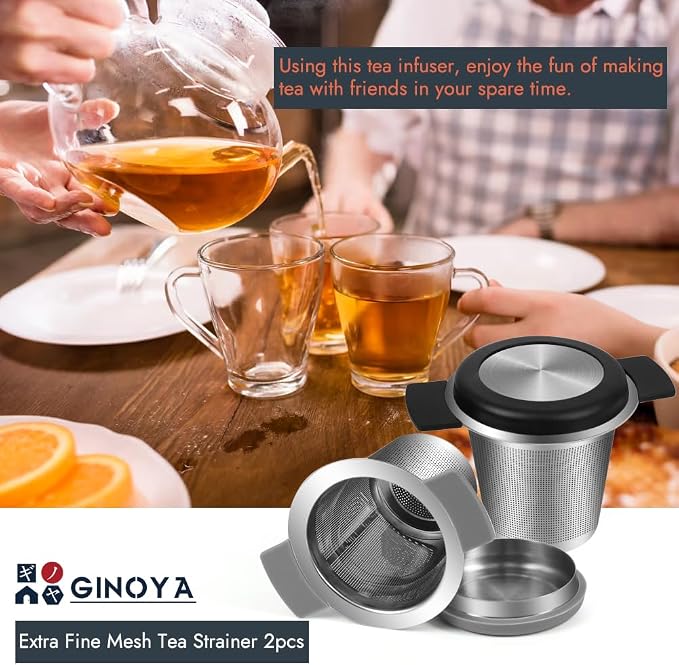Tea being poured into glasses with a tea infuser on a table, featuring the Ginoya brand.