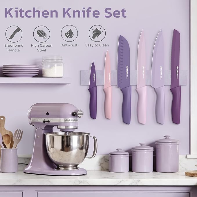 Purple kitchen knife set with mixer and canisters on a countertop