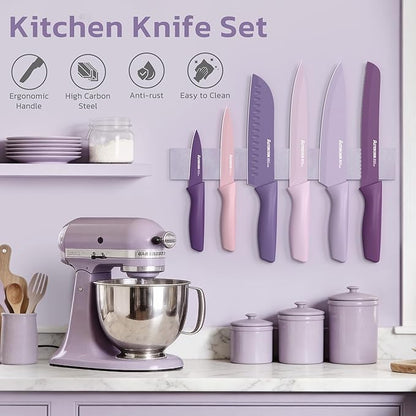Purple kitchen knife set with mixer and canisters on a countertop
