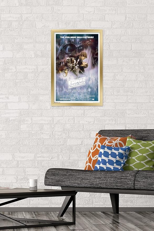 Trends International Star Wars: The Empire Strikes Back - The Saga Continues One Sheet Wall Poster, 14.725" x 22.375", Gold Framed Version