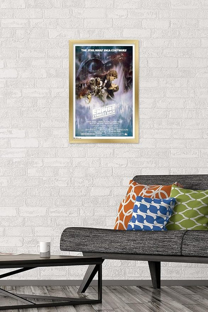 Trends International Star Wars: The Empire Strikes Back - The Saga Continues One Sheet Wall Poster, 14.725" x 22.375", Gold Framed Version