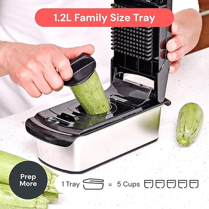 Veggie slicer with a 1.2L family size tray being used to slice a zucchini.
