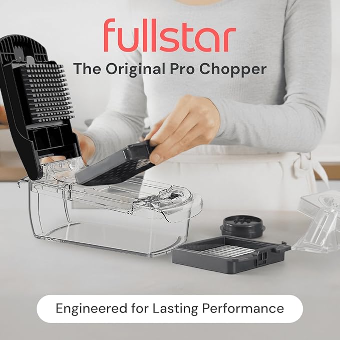 Person using a kitchen chopper with 'fullstar' branding on a white background
