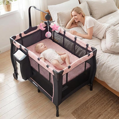 INFANS 3 in 1 Pack and Play, Portable Travel Baby Bassinet with Detachable Mattress, Changing Table, Foldable Playpen with Carry Bag, 2 Wheels (Pink Stripes)